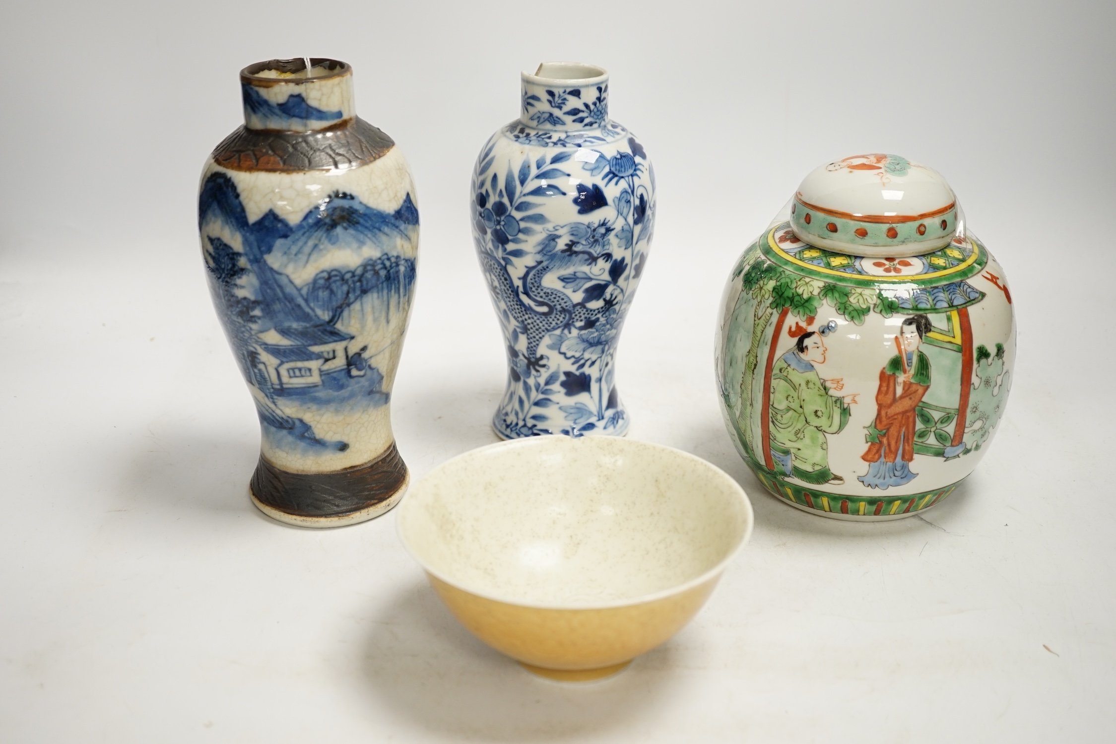 Chinese ceramics to include a crackleware vase and a blue and white vase, a jar and cover and a rice bowl, tallest 20cm high. Condition - all items damaged, overall poor